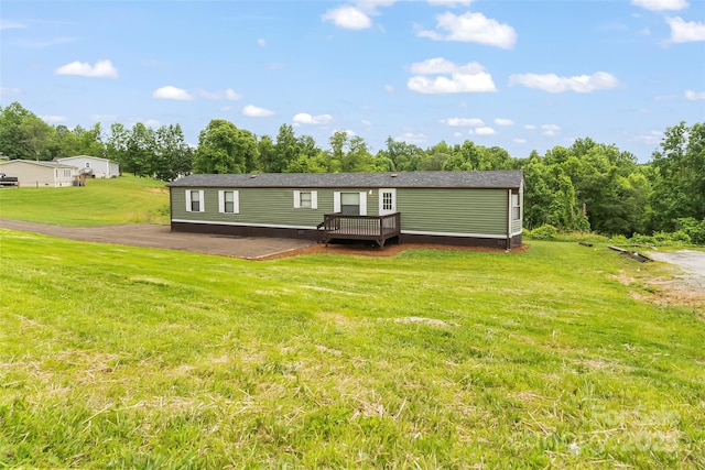 1712 NC-126 Hwy, Morganton, NC 28655 - rear view of property with a wooden deck, a yard, view of scattered trees, and a patio area