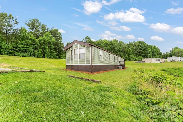 1712 NC-126 Hwy, Morganton, NC 28655 - view of green lawn featuring central AC