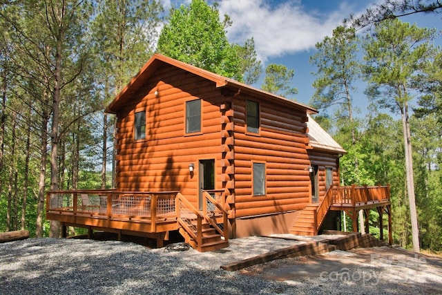 317 Knightsbridge Cir, Union Mills, NC 28167 - view of front of house with log exterior, a deck, and stairway