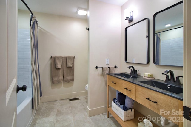 317 Knightsbridge Cir, Union Mills, NC 28167 - bathroom featuring double vanity, shower / bath combination with curtain, toilet, and baseboards