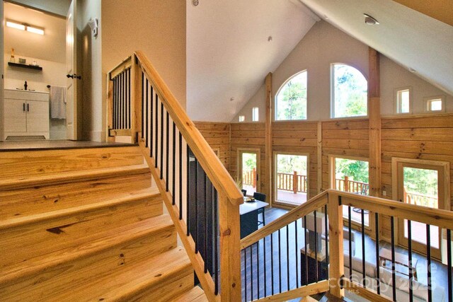 317 Knightsbridge Cir, Union Mills, NC 28167 - stairs with high vaulted ceiling and wooden walls
