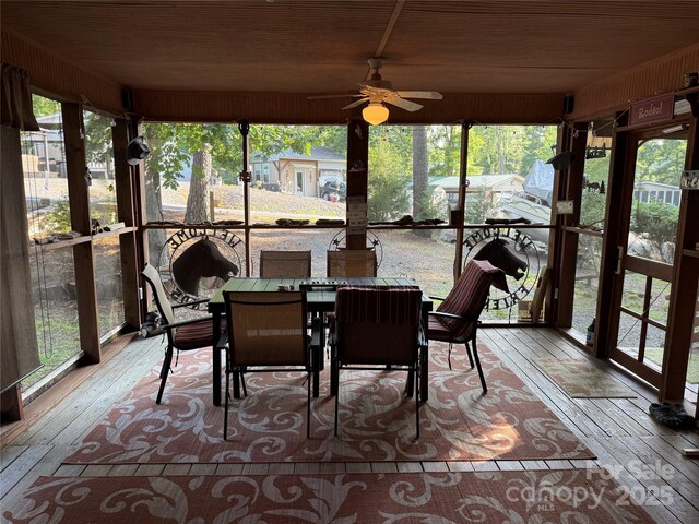 160/162 Arrowood Trl Unit F28/F29, Mount Gilead, NC 27306 - sunroom featuring a ceiling fan, wood-type flooring, wood ceiling, outdoor dining area, and plenty of natural light