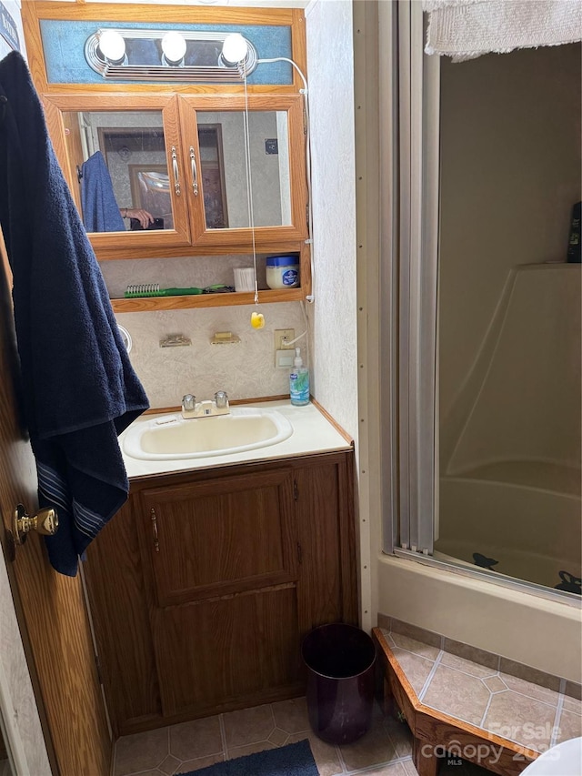 160/162 Arrowood Trl Unit F28/F29, Mount Gilead, NC 27306 - bathroom featuring an enclosed shower, vanity, and tile patterned flooring