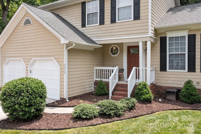 7212 Morsey Ct, Charlotte, NC 28269 - view of front of house with an attached garage, a shingled roof, and covered porch