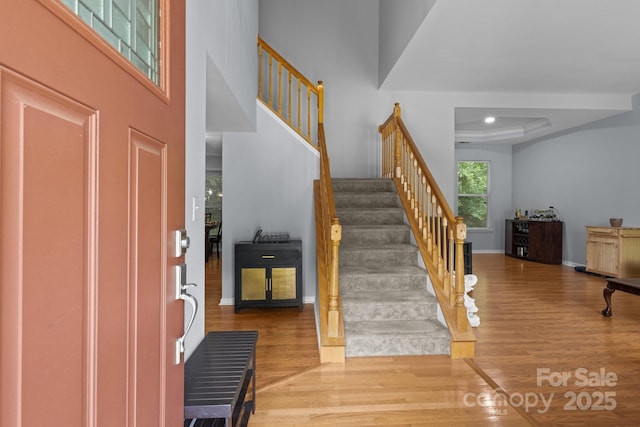 7212 Morsey Ct, Charlotte, NC 28269 - entryway with wood finished floors, stairs, baseboards, and a high ceiling