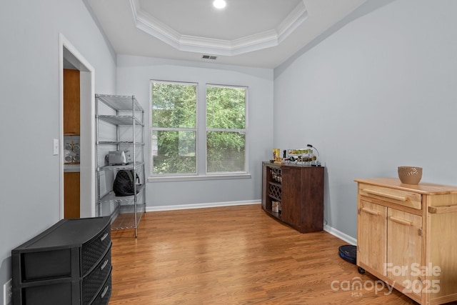 7212 Morsey Ct, Charlotte, NC 28269 - office area with a raised ceiling, crown molding, light wood-type flooring, and baseboards