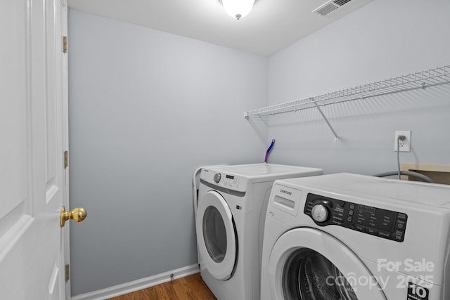 7212 Morsey Ct, Charlotte, NC 28269 - laundry room with independent washer and dryer, wood finished floors, and baseboards