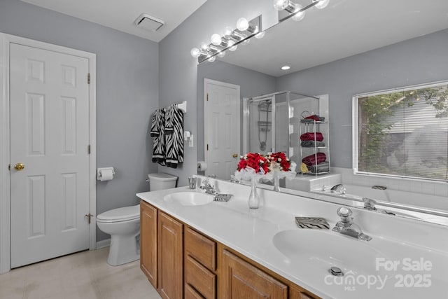 7212 Morsey Ct, Charlotte, NC 28269 - bathroom featuring a stall shower, toilet, double vanity, and a garden tub