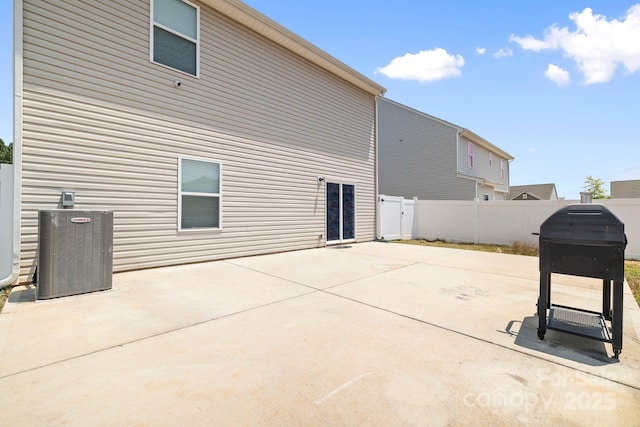 2011 Valdosta Way, Charlotte, NC 28215 - back of house featuring central AC, a patio, and a fenced backyard