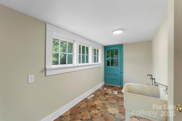 202 Glenn Ave, Kannapolis, NC 28081 - doorway to outside featuring baseboards