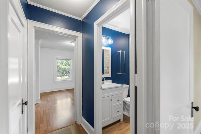 202 Glenn Ave, Kannapolis, NC 28081 - hallway featuring light wood finished floors and crown molding