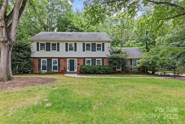 2917 Rustic Ln, Charlotte, NC 28210 - colonial house with brick siding and a front yard