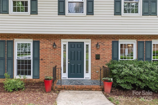 2917 Rustic Ln, Charlotte, NC 28210 - doorway to property featuring brick siding