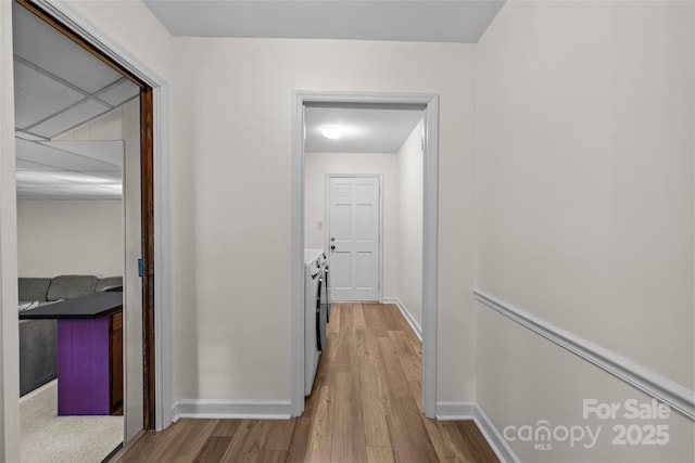 2917 Rustic Ln, Charlotte, NC 28210 - hallway featuring washer and clothes dryer and wood finished floors