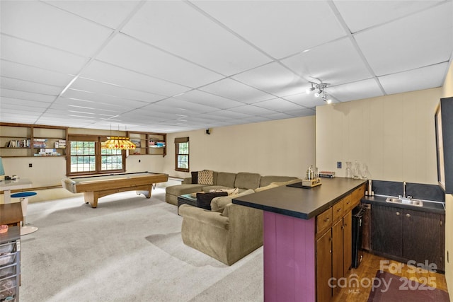 2917 Rustic Ln, Charlotte, NC 28210 - living room featuring a paneled ceiling, pool table, and carpet flooring