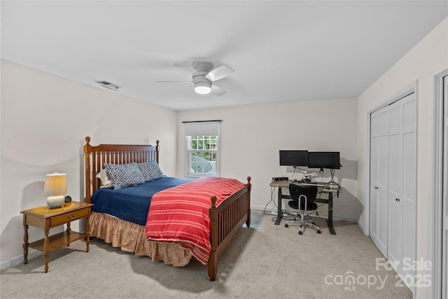 2917 Rustic Ln, Charlotte, NC 28210 - carpeted bedroom with a desk, ceiling fan, and a closet