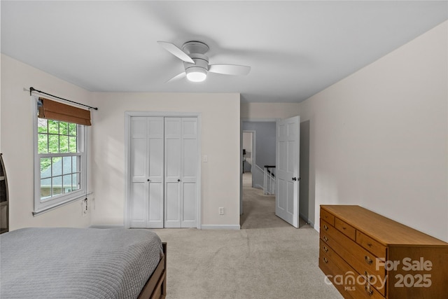 2917 Rustic Ln, Charlotte, NC 28210 - bedroom featuring light carpet, a ceiling fan, and a closet