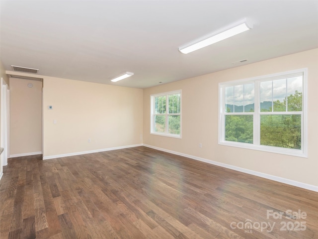 558 Liner Cove Rd, Waynesville, NC 28786 - spare room featuring dark wood-type flooring and baseboards