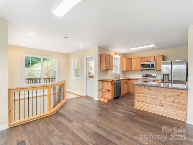 558 Liner Cove Rd, Waynesville, NC 28786 - kitchen featuring appliances with stainless steel finishes, dark wood-type flooring, recessed lighting, and light stone countertops