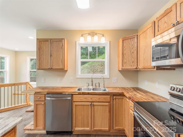 558 Liner Cove Rd, Waynesville, NC 28786 - kitchen featuring appliances with stainless steel finishes, wood finished floors, butcher block countertops, and recessed lighting