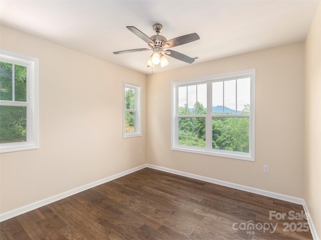 558 Liner Cove Rd, Waynesville, NC 28786 - spare room with dark wood-style flooring and ceiling fan