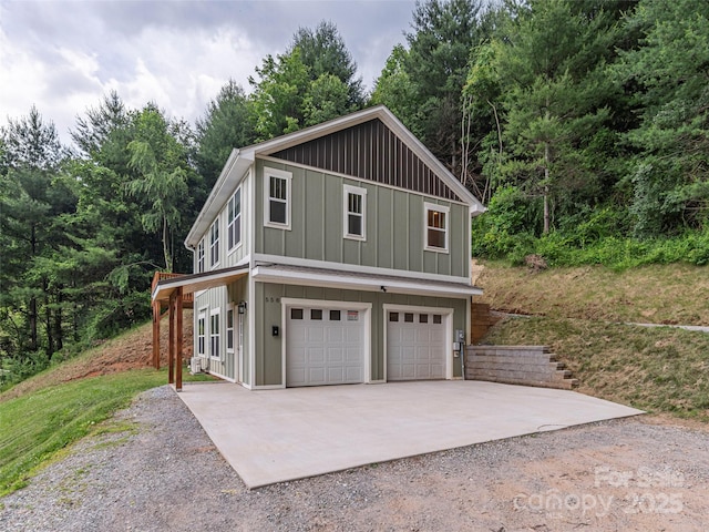 558 Liner Cove Rd, Waynesville, NC 28786 - view of side of property with board and batten siding and concrete driveway