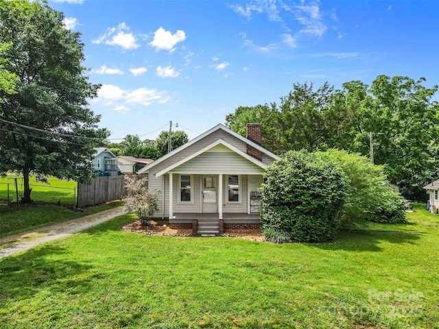 2519 2nd Ave SW, Hickory, NC 28602 - bungalow with a porch, dirt driveway, and a chimney