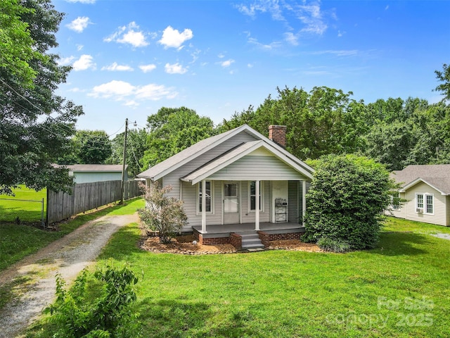 2519 2nd Ave SW, Hickory, NC 28602 - view of front facade featuring driveway, a porch, and a chimney