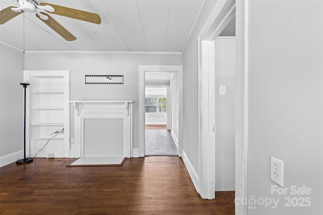 2519 2nd Ave SW, Hickory, NC 28602 - unfurnished living room featuring ceiling fan, wood finished floors, and ornamental molding