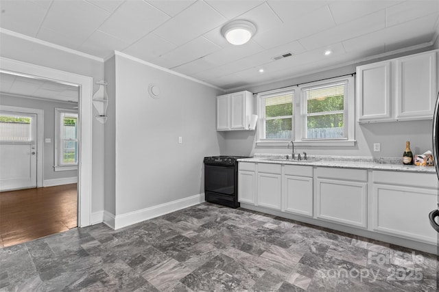 2519 2nd Ave SW, Hickory, NC 28602 - kitchen featuring black gas stove, crown molding, and white cabinets