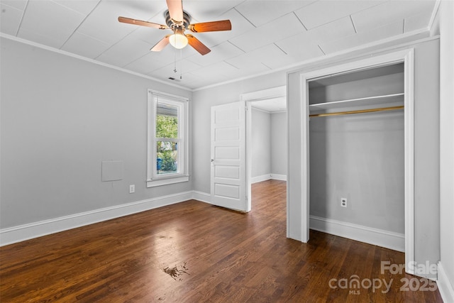 2519 2nd Ave SW, Hickory, NC 28602 - unfurnished bedroom with dark wood-style floors, a closet, ornamental molding, and ceiling fan
