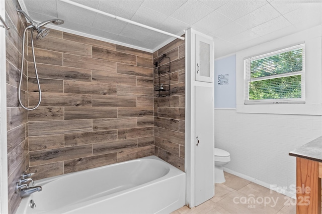 2519 2nd Ave SW, Hickory, NC 28602 - full bathroom with washtub / shower combination, vanity, tile patterned flooring, and a wainscoted wall