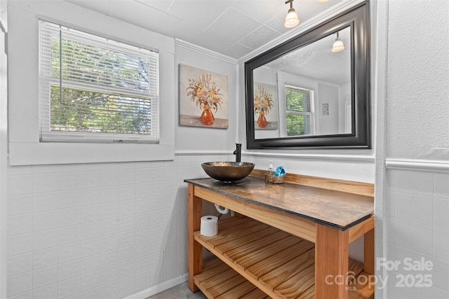 2519 2nd Ave SW, Hickory, NC 28602 - bathroom with vanity, wainscoting, plenty of natural light, and tile walls