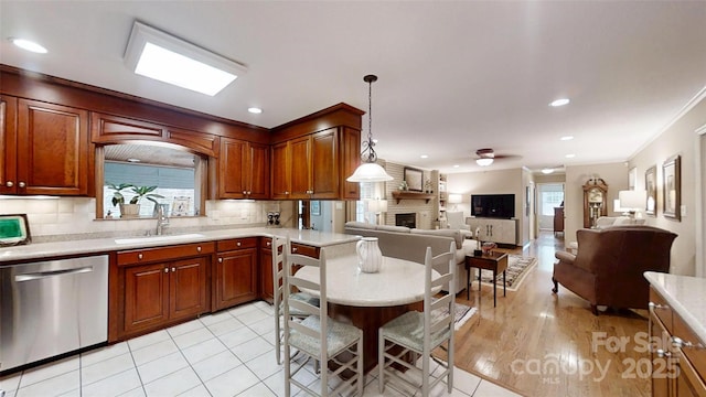 1695 Arden Dr, Lincolnton, NC 28092 - kitchen with stainless steel dishwasher, light countertops, decorative backsplash, open floor plan, and recessed lighting