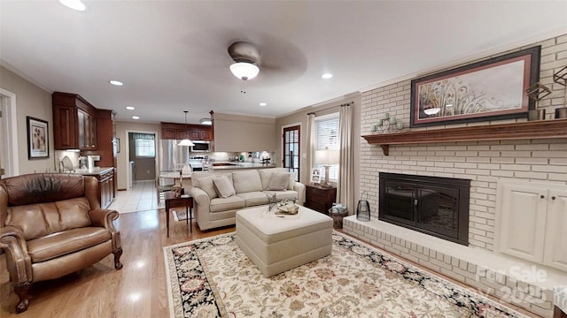 1695 Arden Dr, Lincolnton, NC 28092 - living room with ornamental molding, a fireplace, light wood-type flooring, recessed lighting, and ceiling fan