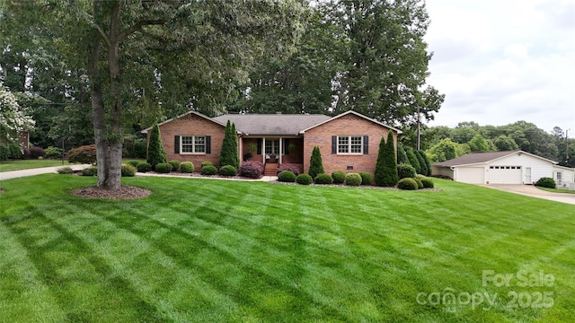 1695 Arden Dr, Lincolnton, NC 28092 - ranch-style home with brick siding, a front lawn, covered porch, and a detached garage