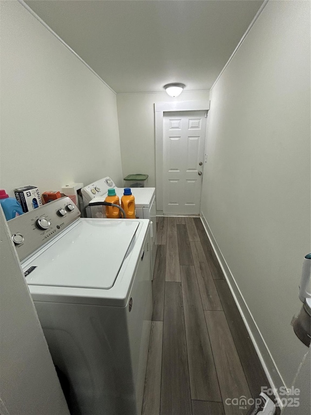 512 S Gray St, Gastonia, NC 28052 - laundry room with washing machine and clothes dryer, dark wood-type flooring, and baseboards