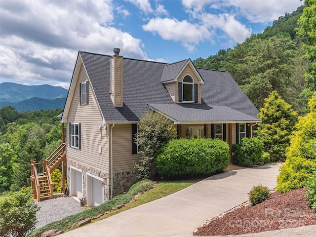 80 Feather Ln, Waynesville, NC 28786 - new england style home featuring stairway, a garage, stone siding, a chimney, and driveway