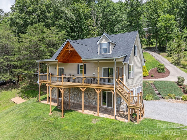 80 Feather Ln, Waynesville, NC 28786 - rear view of house with stairway, a deck, stone siding, a yard, and roof with shingles
