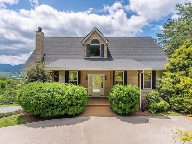 80 Feather Ln, Waynesville, NC 28786 - view of front of home with covered porch, a chimney, and roof with shingles