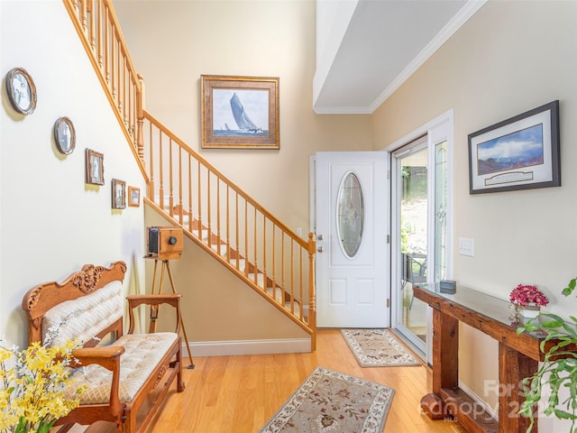 80 Feather Ln, Waynesville, NC 28786 - entrance foyer with stairway, light wood finished floors, and ornamental molding