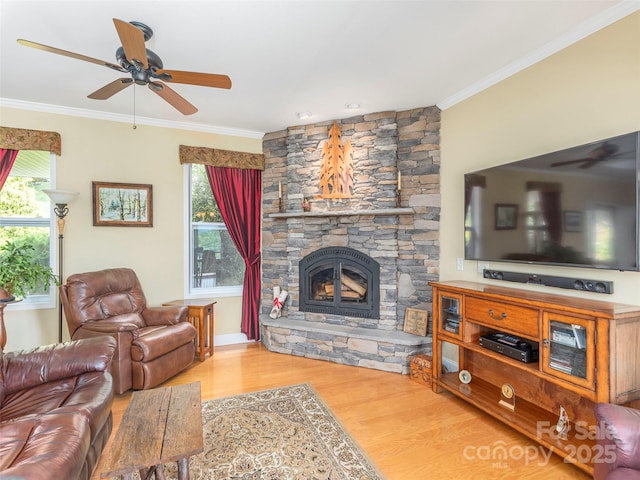 80 Feather Ln, Waynesville, NC 28786 - living area featuring ceiling fan, ornamental molding, wood finished floors, and a stone fireplace