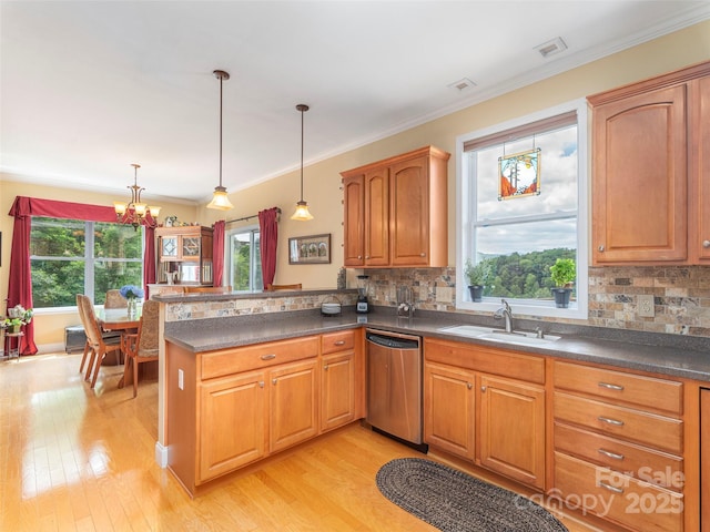 80 Feather Ln, Waynesville, NC 28786 - kitchen with stainless steel dishwasher, a peninsula, a chandelier, light wood finished floors, and crown molding