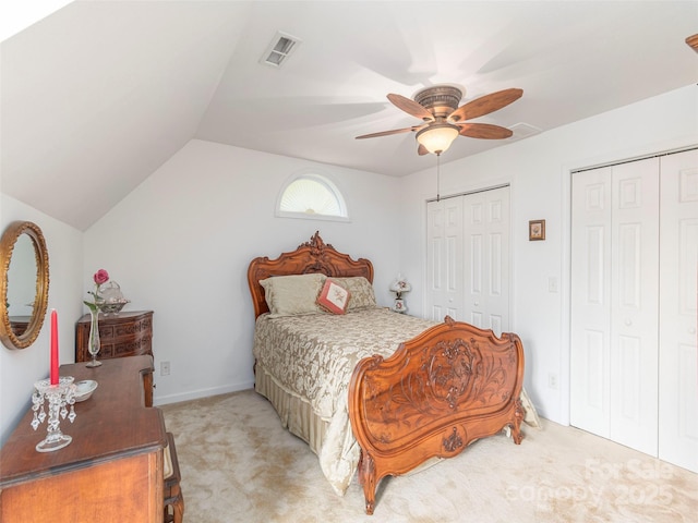 80 Feather Ln, Waynesville, NC 28786 - bedroom featuring multiple closets, light carpet, vaulted ceiling, and a ceiling fan