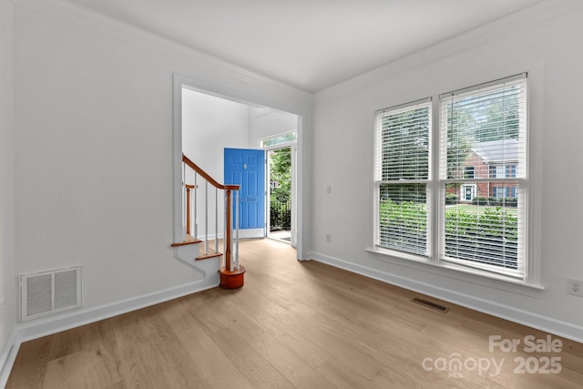 15400 Groveland St, Huntersville, NC 28078 - empty room with crown molding, wood finished floors, and stairway