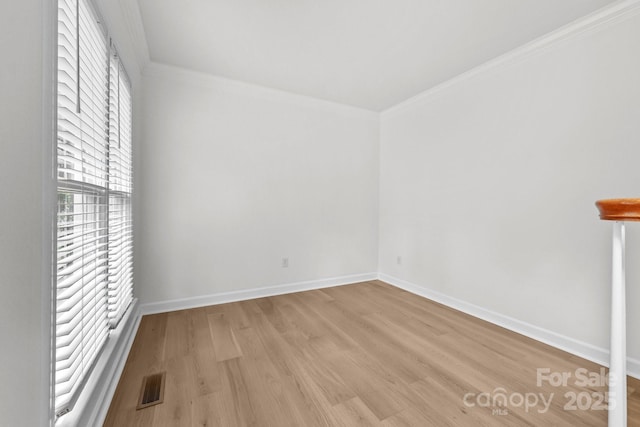 15400 Groveland St, Huntersville, NC 28078 - empty room featuring plenty of natural light, light wood finished floors, and crown molding