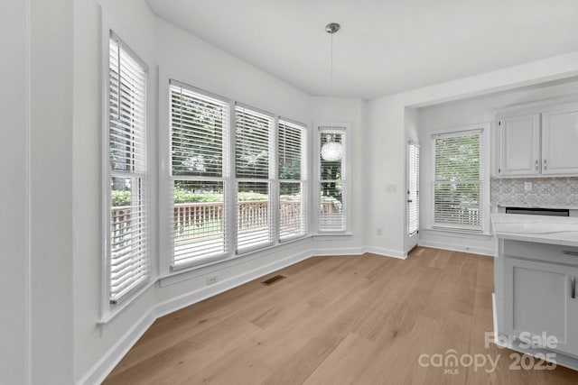 15400 Groveland St, Huntersville, NC 28078 - unfurnished dining area with light wood-style floors and baseboards
