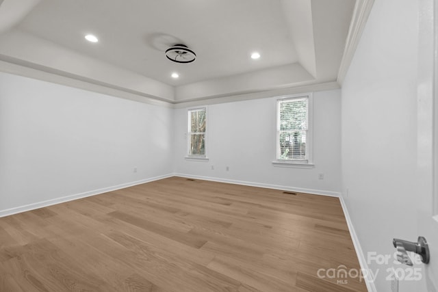 15400 Groveland St, Huntersville, NC 28078 - empty room with a tray ceiling, light wood finished floors, and recessed lighting