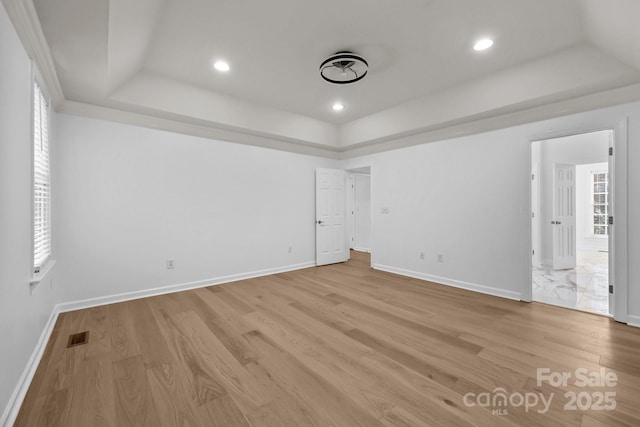 15400 Groveland St, Huntersville, NC 28078 - spare room with a raised ceiling, light wood-style floors, and recessed lighting
