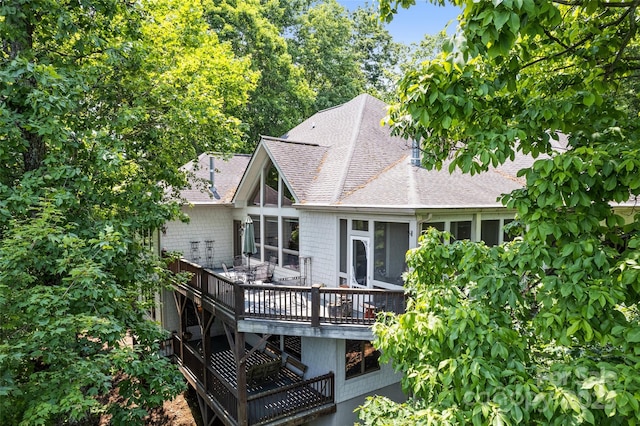 102 Coyote Rdg, Maggie Valley, NC 28751 - back of property with a shingled roof, a wooden deck, and a sunroom